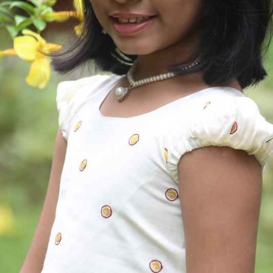 Skirt and top with embroidery and puff sleeve